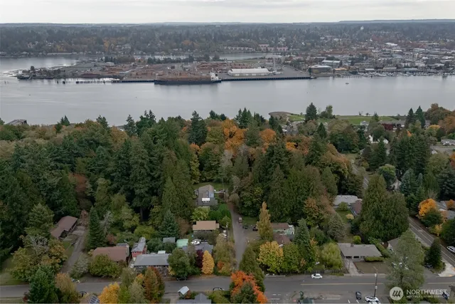 an aerial view of a city with lake view