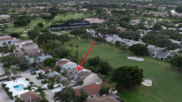 an aerial view of a house with outdoor space lake view and lake view in back