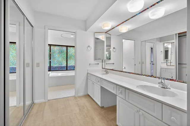 an empty room with a bathroom and a shower