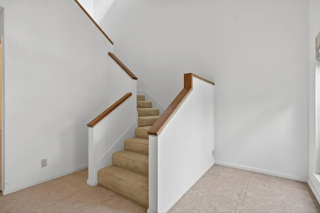 a kitchen with granite countertop cabinets stainless steel appliances a sink and dishwasher