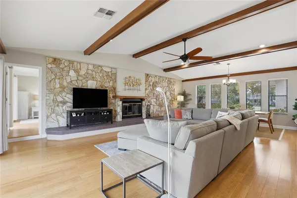 a living room with furniture and a large window