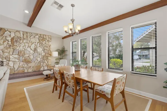 a bath tub sitting in a bathroom next to a sink