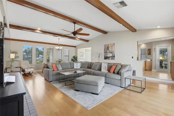 a spacious bathroom with a tub sink and mirror