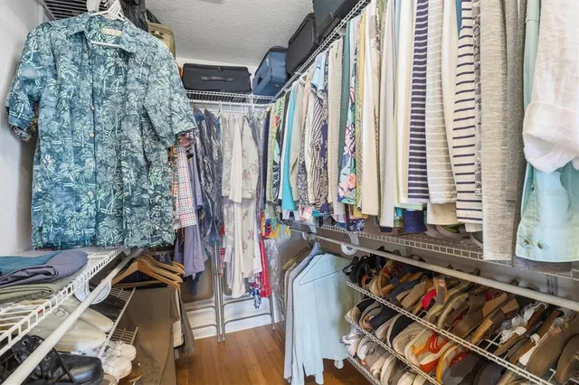 a view of a livingroom with furniture and a window
