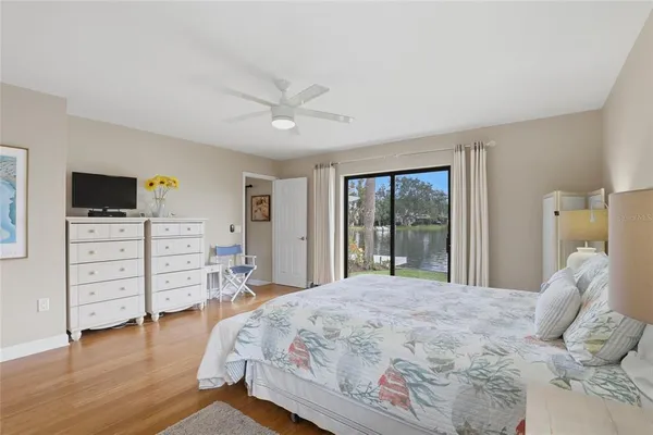 a bedroom with a bed and a table chair