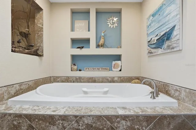 a view of a swimming pool and outdoor seating