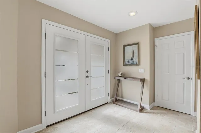 a kitchen with stainless steel appliances granite countertop a stove top oven a sink dishwasher a refrigerator and a refrigerator