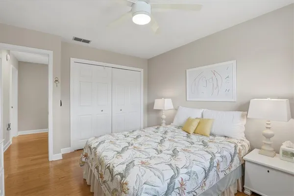 a lake view with tables and chairs