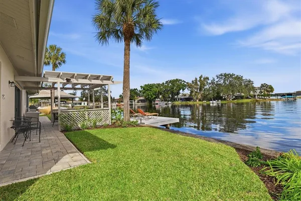 a view of houses with outdoor seating and lake view