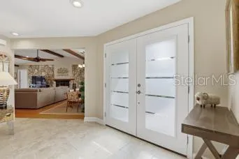 a kitchen with stainless steel appliances granite countertop a stove top oven a sink dishwasher a refrigerator and a refrigerator