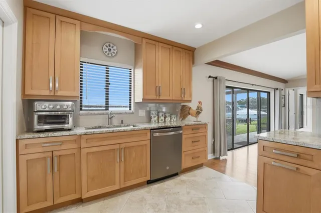 a dining room with furniture window and wooden floor
