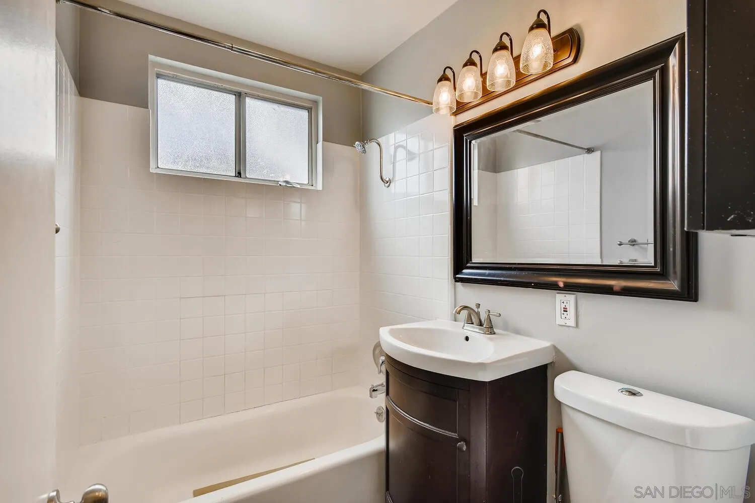 9340 Oakbourne Road Santee, CA 92071 - Photo 21 of 26 a bathroom with a toilet sink and mirror