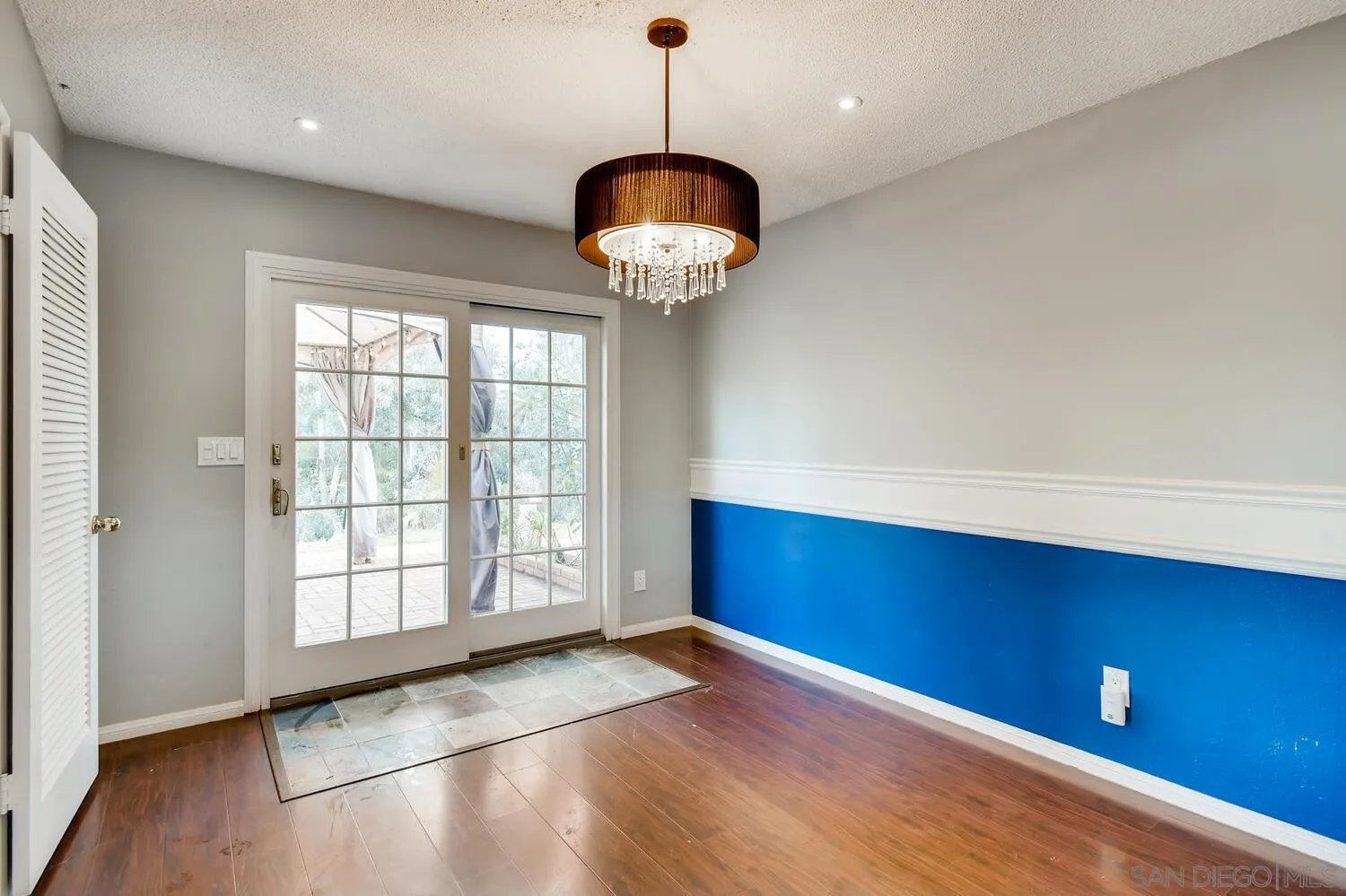 9340 Oakbourne Road Santee, CA 92071 - Photo 9 of 26 a view of an empty room with window and wooden floor