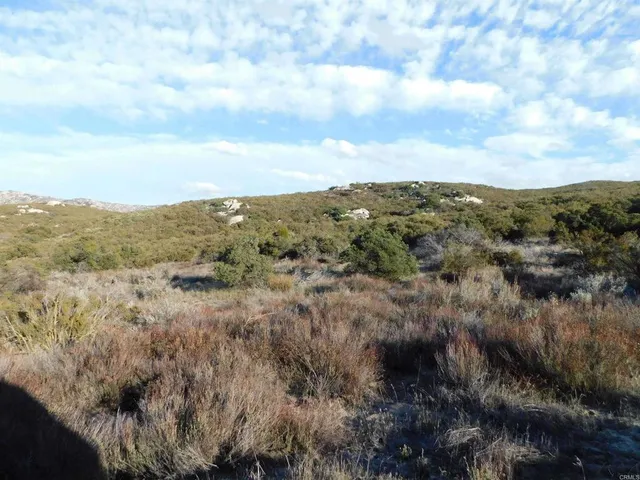 a view of mountains and valleys