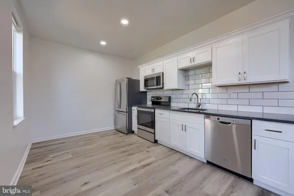 a kitchen with granite countertop a sink