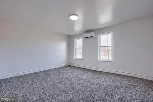a view of an empty room and entryway