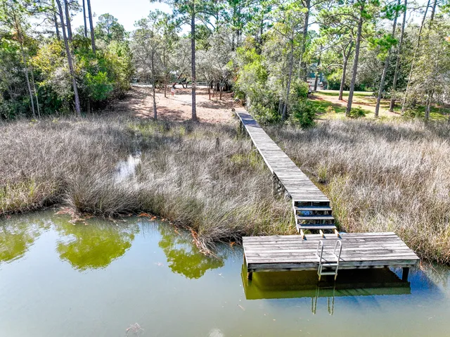 a view of a lake with sitting area
