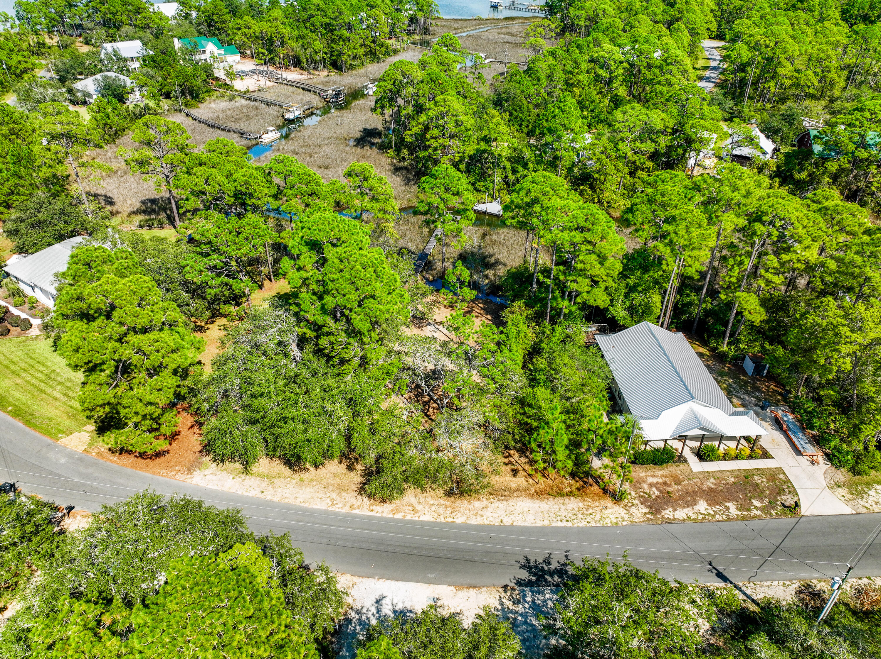 212 Pisces Drive Santa Rosa Beach, FL 32459 - Photo 16 of 17 an aerial view of a house with a yard and garden