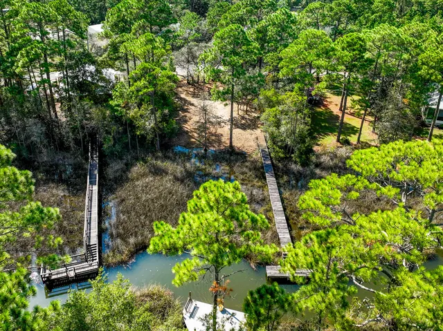 a view of a lake with a yard and sitting area