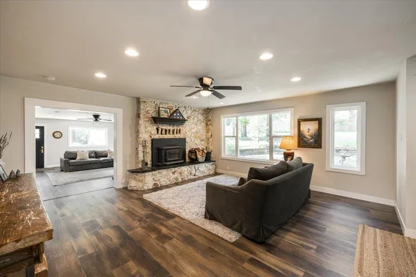 a living room with furniture window and a fireplace