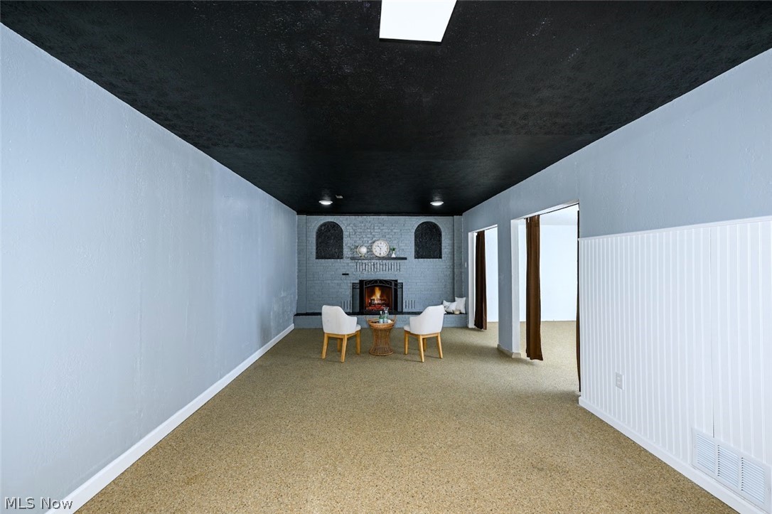 6151 Taylor Road Clinton, OH 44216 - Photo 40 of 49 *RECREATION ROOM IN BASEMENT FINISHED. NATURE STONE FLOORING AND 2ND FIREPLACE ~