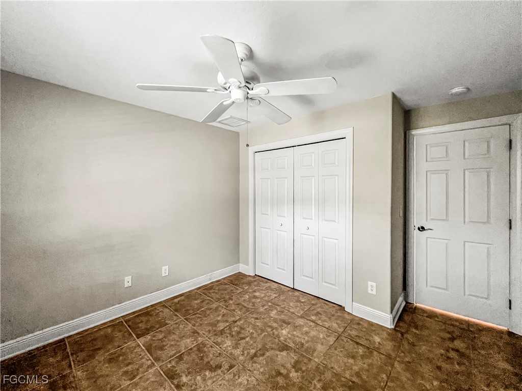 13437 First Street Fort Myers, FL 33905 - Photo 13 of 22 an empty room with fan and fan