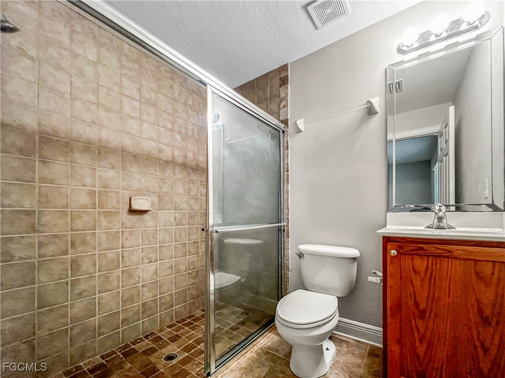 13437 First Street Fort Myers, FL 33905 - Photo 17 of 22 a bathroom with a toilet sink and shower