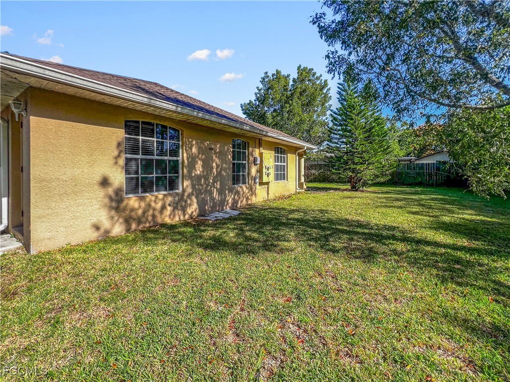 13437 First Street Fort Myers, FL 33905 - Photo 21 of 22 a front view of a house with garden