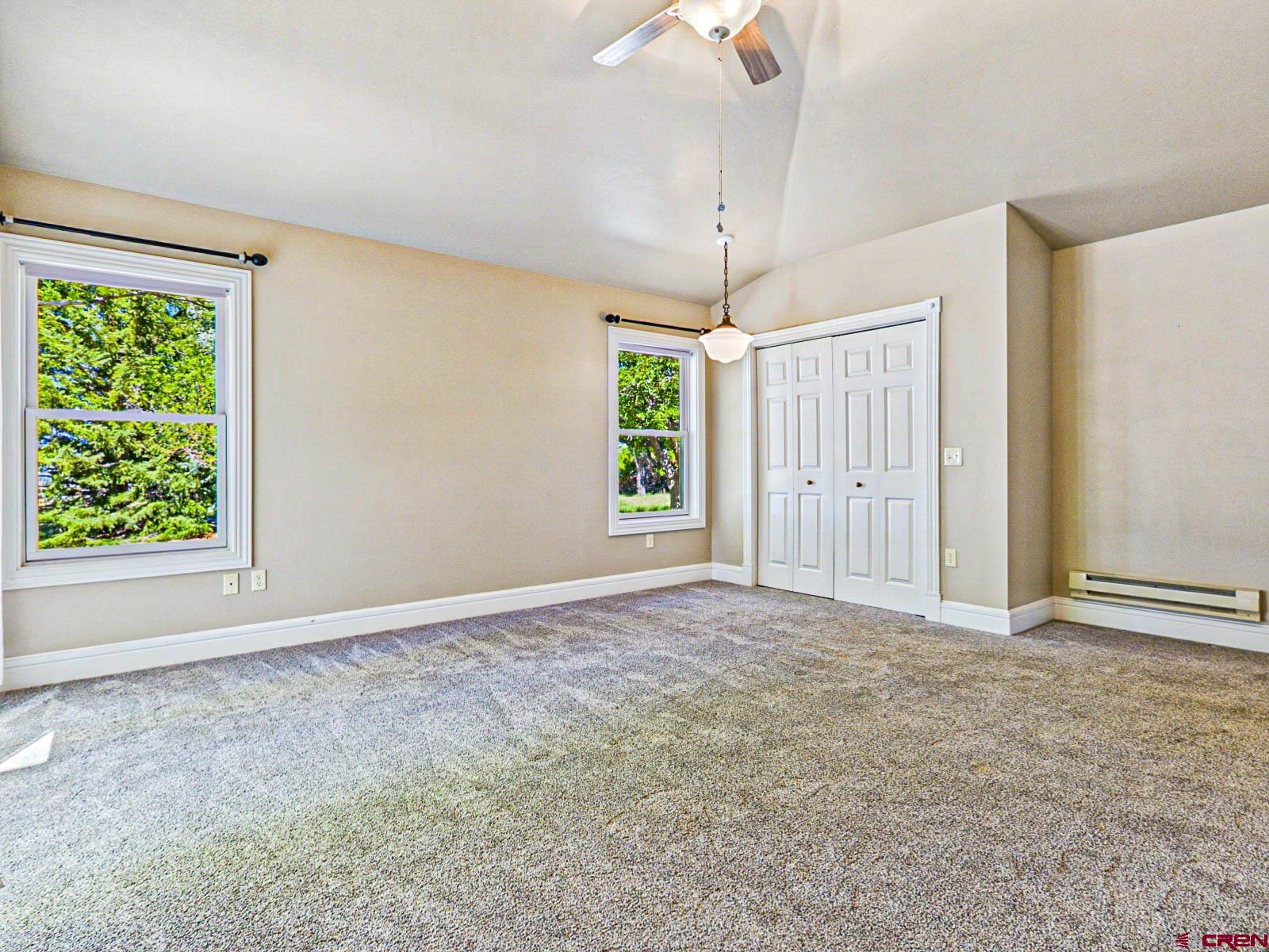 16331 2550th Road Cedaredge, CO 81413 - Photo 23 of 45 an empty room with windows and outdoor view
