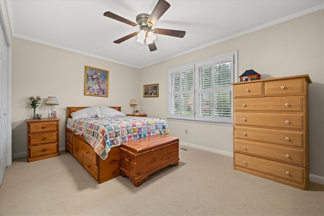 2004 Cardinal Park Drive Anderson, SC 29621 - Photo 27 of 40 Carpeted flooring and custom plantation shutters accent this comfortable bedroom space.
