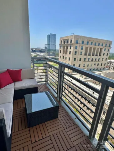a view of a balcony with wooden floor
