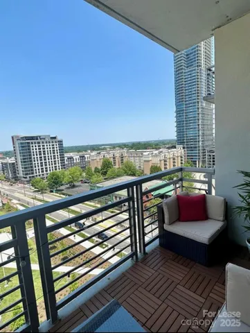a view of balcony with furniture