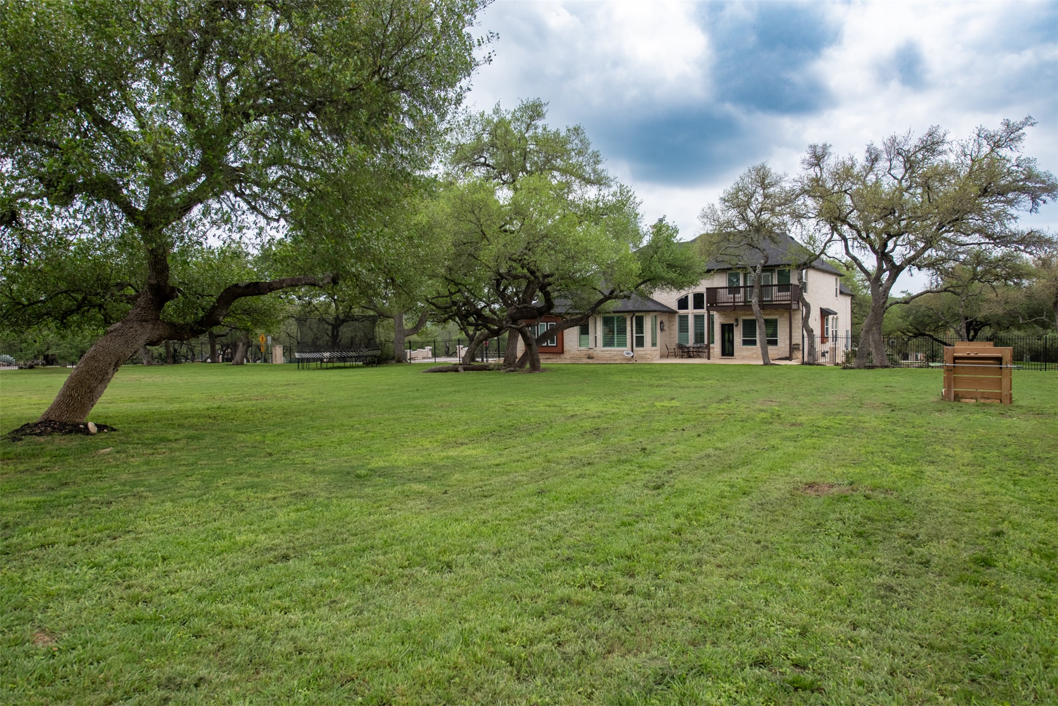 664 Ranchers Club Lane, Unit 1 Driftwood, TX 78619 - Photo 18 of 40 a view of a park with large trees