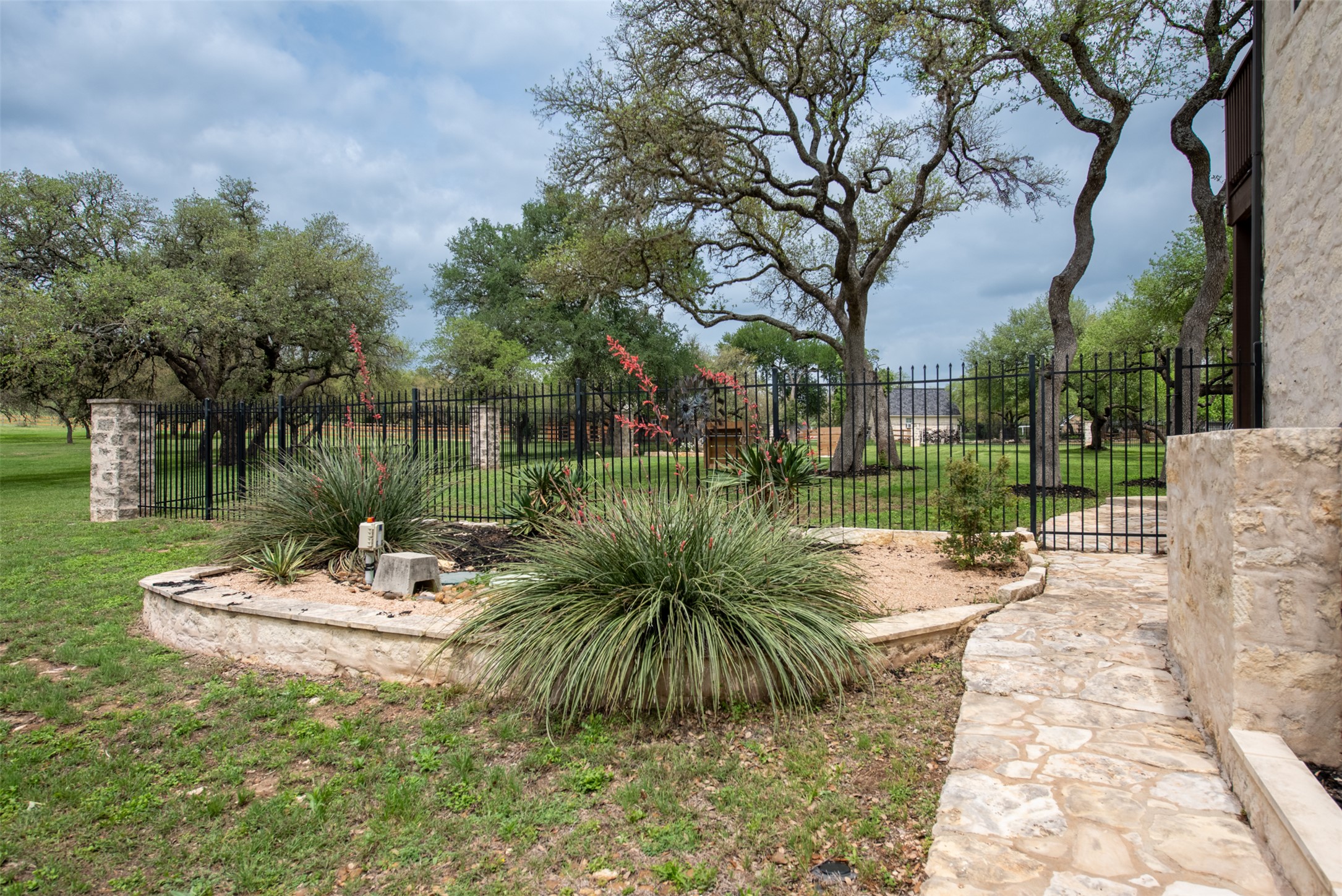 664 Ranchers Club Lane, Unit 1 Driftwood, TX 78619 - Photo 30 of 40 a view of a lake with a patio