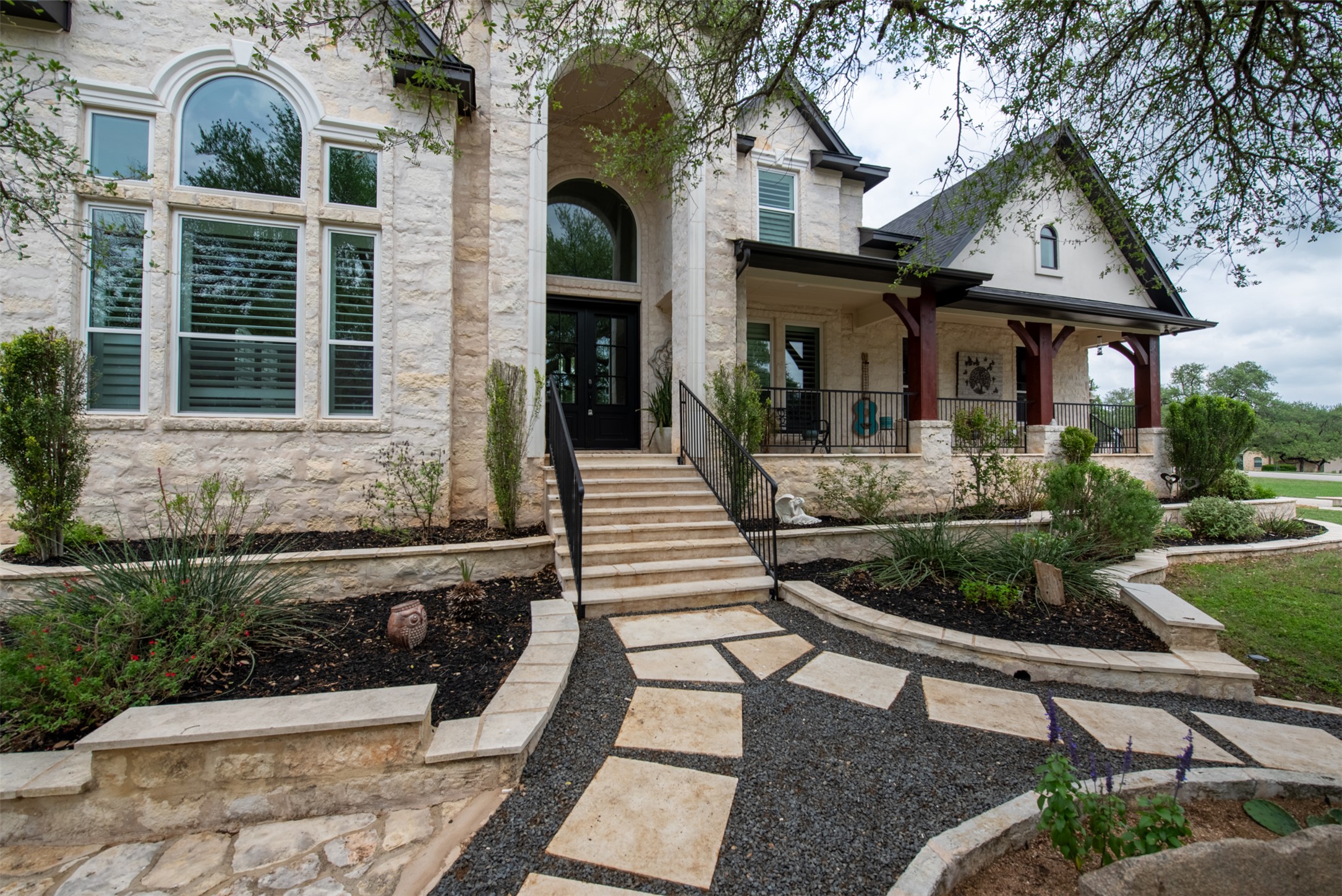 664 Ranchers Club Lane, Unit 1 Driftwood, TX 78619 - Photo 3 of 40 a front view of a house with porch