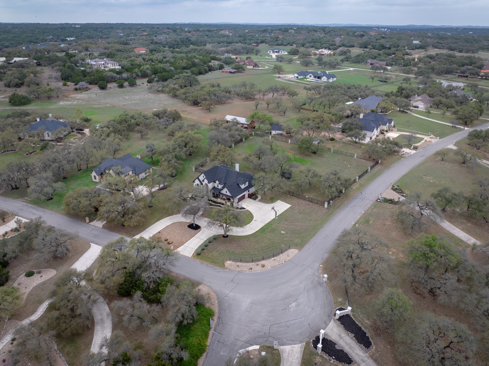 664 Ranchers Club Lane, Unit 1 Driftwood, TX 78619 - Photo 39 of 40 an aerial view of a house with a yard