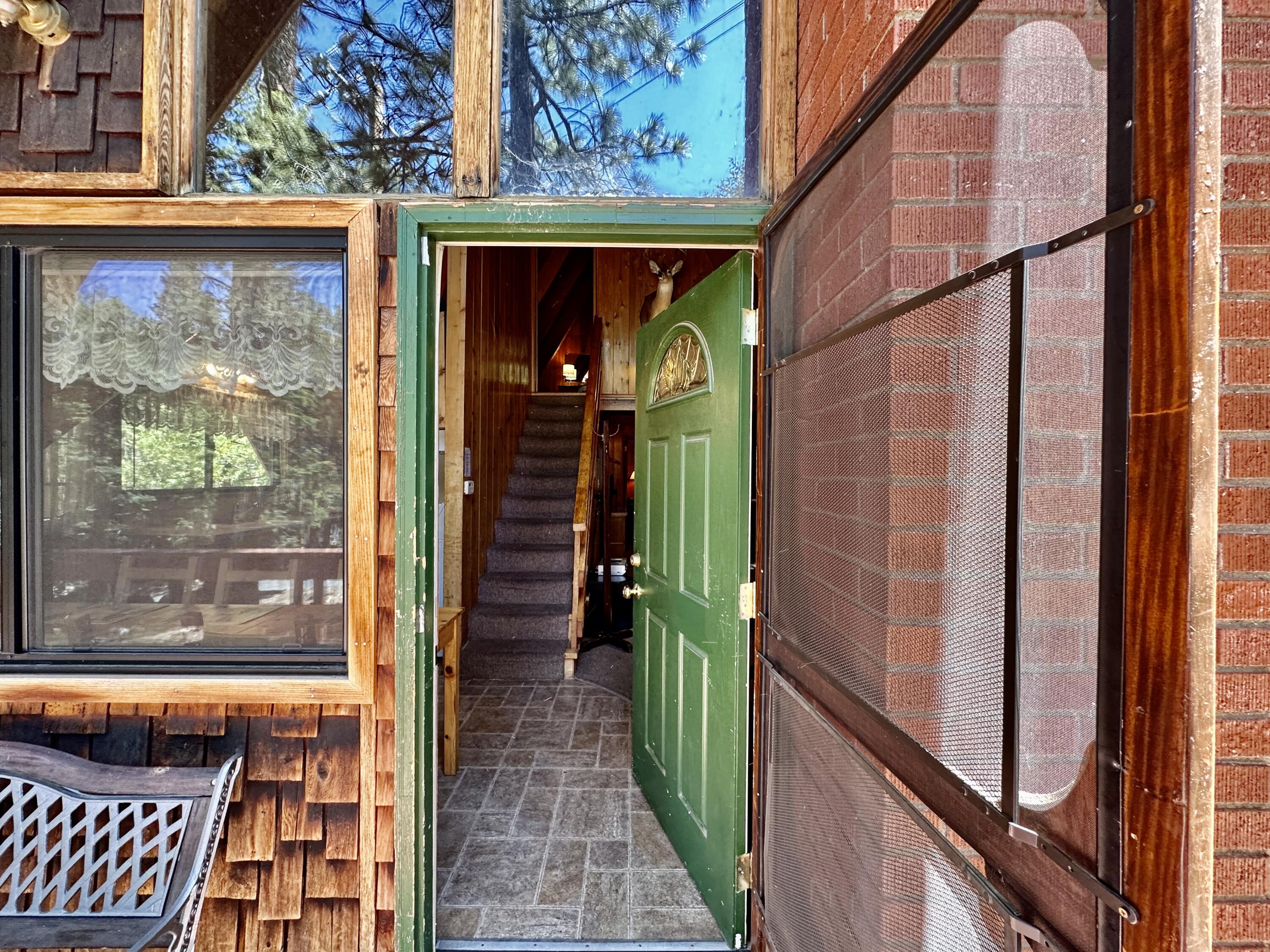 24560 Upper Rim Rock Road Idyllwild, CA 92549 - Photo 7 of 56 a picture of a door of the house