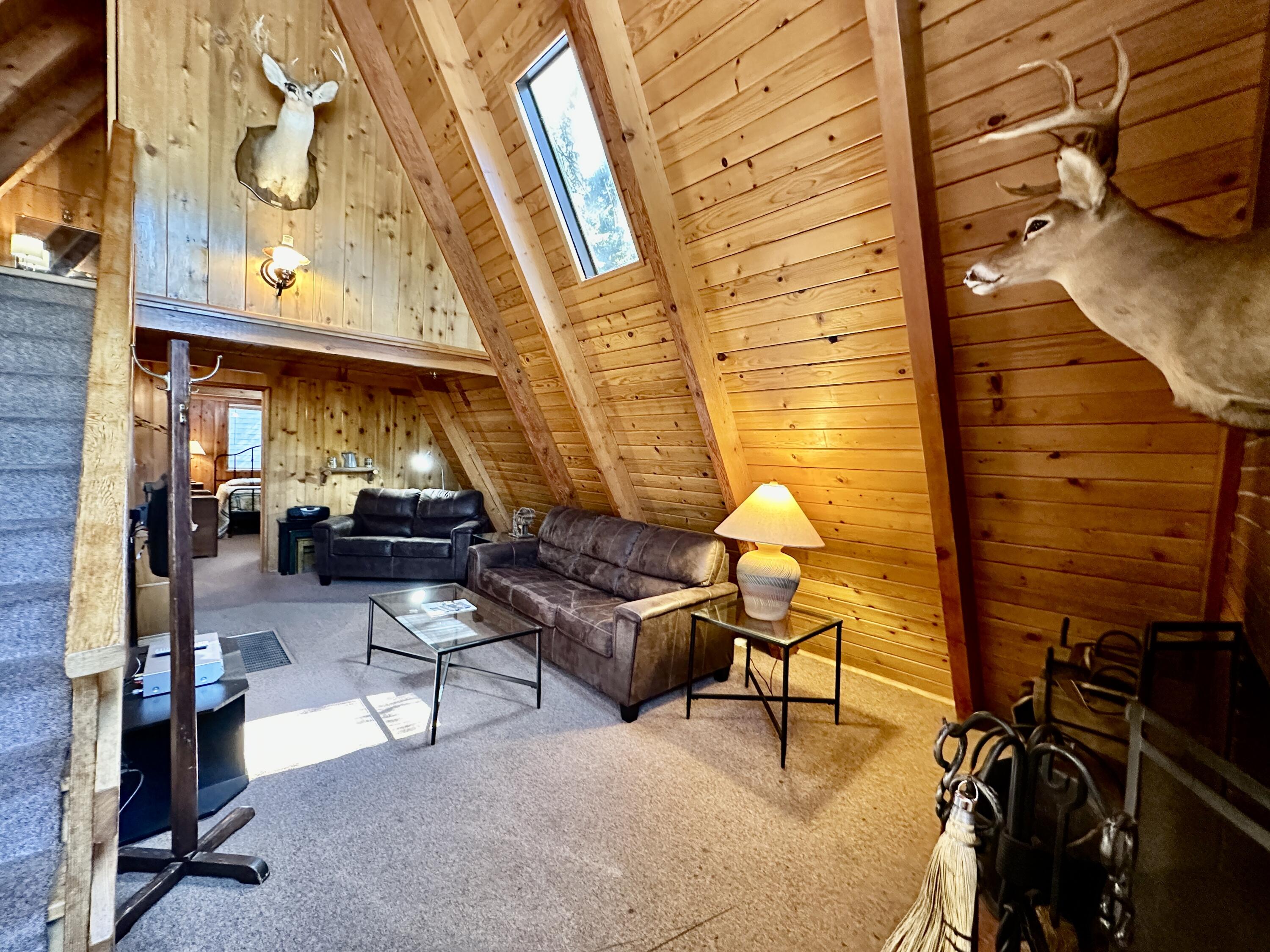 24560 Upper Rim Rock Road Idyllwild, CA 92549 - Photo 8 of 56 a living room filled with furniture