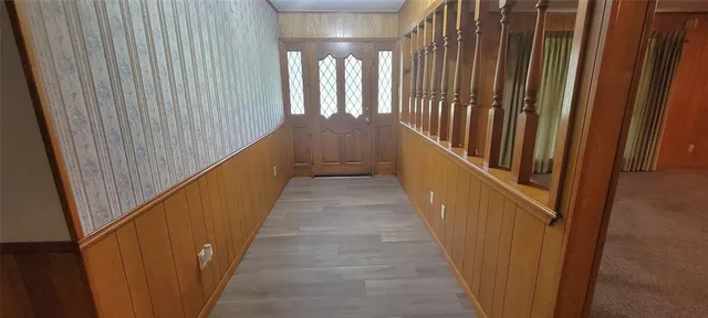 a kitchen with stainless steel appliances granite countertop a refrigerator and a stove