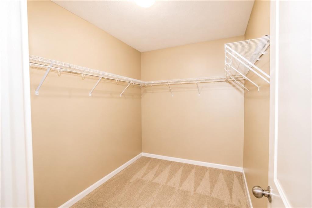 2078 Autumn Ridge Way Auburn, AL 36879 - Photo 18 of 24 Walk-in closet with wire shelving system and neutral carpeting