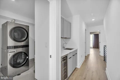 a bathroom with a toilet a sink a mirror and bathtub