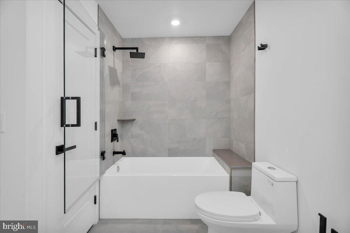 2615 East Boston Street, Unit 2 Philadelphia, PA 19125 - Photo 16 of 24 a bathroom with a toilet and a bath tub