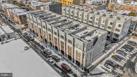 a couple of cars parked in front of a building
