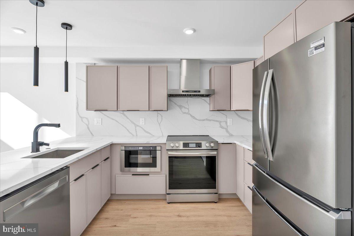 2615 East Boston Street, Unit 2 Philadelphia, PA 19125 - Photo 7 of 24 a kitchen with a stove sink and refrigerator
