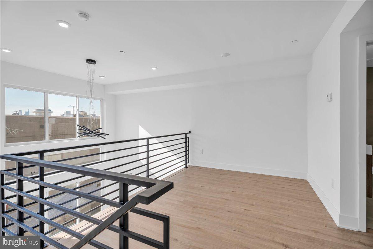 2615 East Boston Street, Unit 2 Philadelphia, PA 19125 - Photo 8 of 24 a view of a room with wooden floor and windows