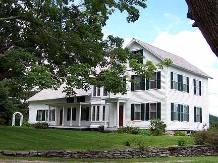 1180 Hawley Road Ashfield, MA 01330 - Photo 2 of 26 a front view of a house with a garden and plants