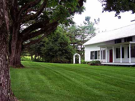 1180 Hawley Road Ashfield, MA 01330 - Photo 23 of 26 a front view of a house with a garden