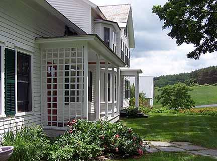 1180 Hawley Road Ashfield, MA 01330 - Photo 25 of 26 front view of a house with a yard