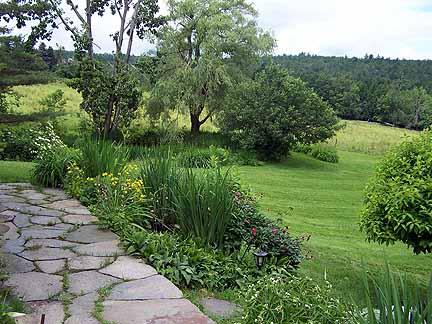 1180 Hawley Road Ashfield, MA 01330 - Photo 10 of 26 a view of a garden with a lake