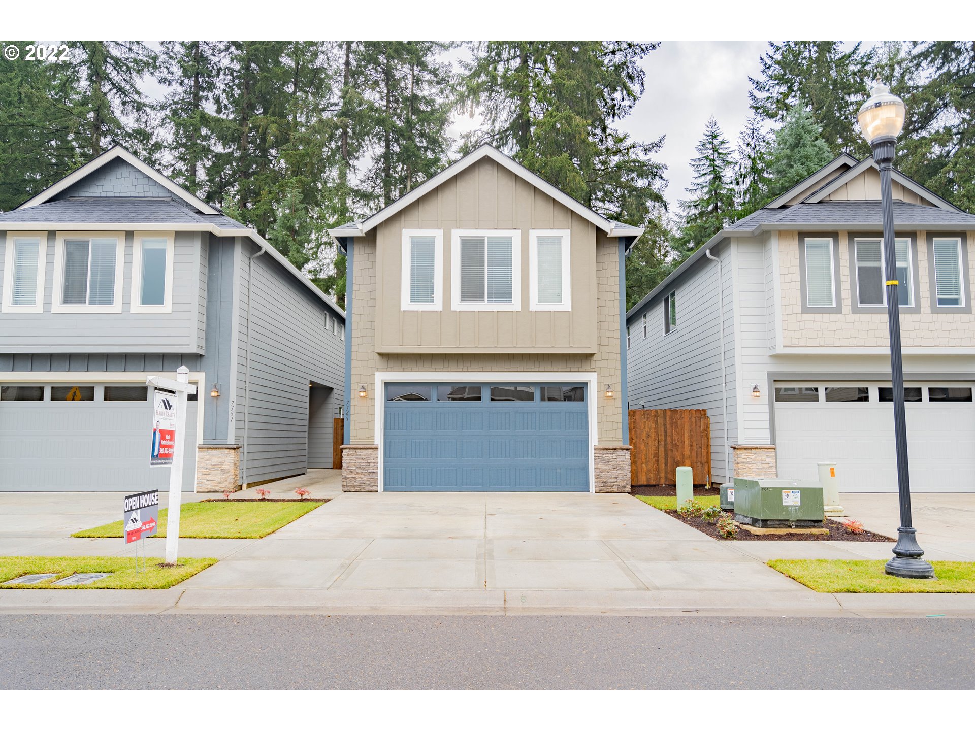 7143 South 13th Street Ridgefield, WA 98642 - Photo 1 of 31 a front view of a house with a yard and garage